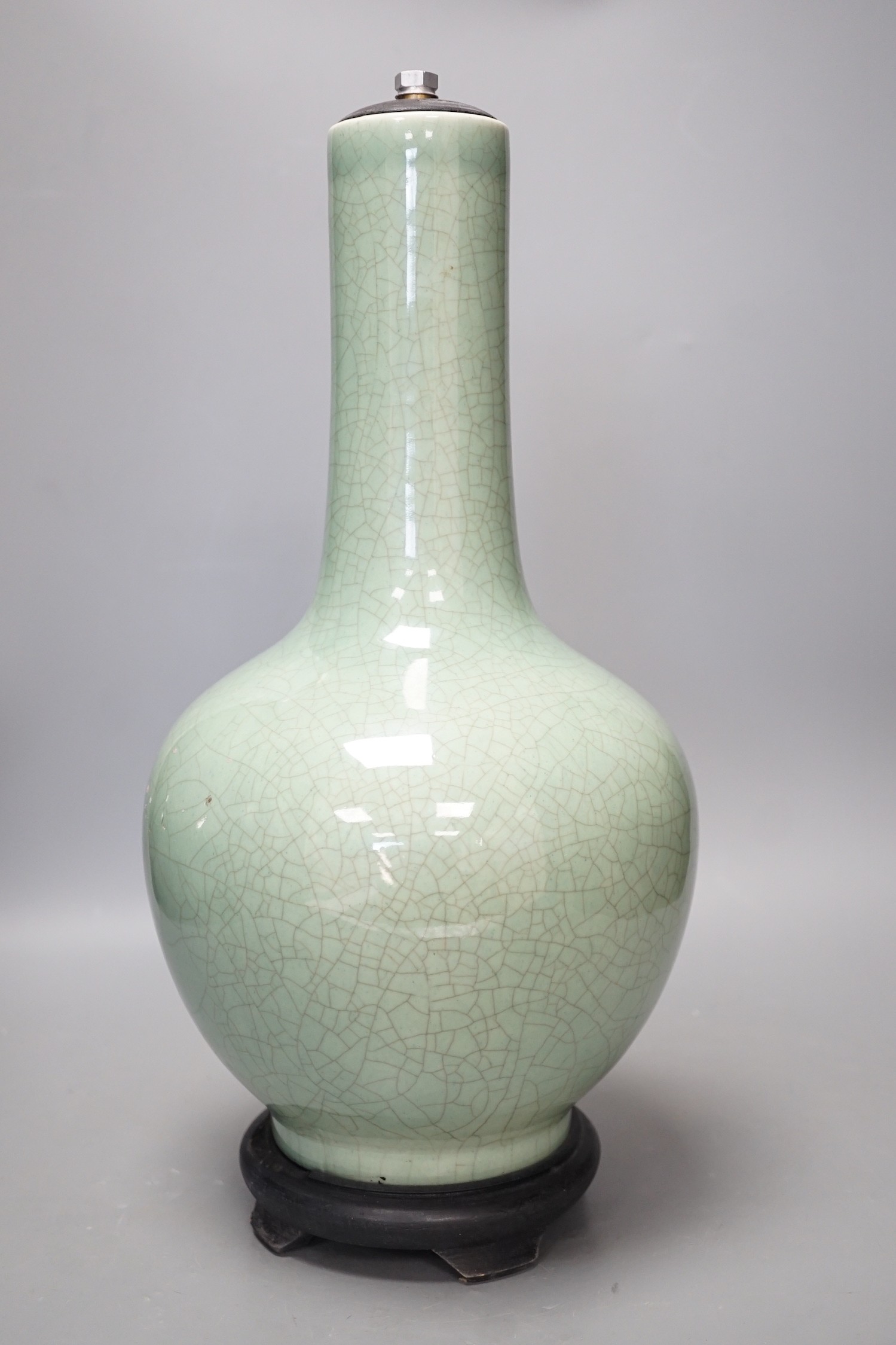 A Chinese celadon glazed Guan type vase on stand, 42cms high